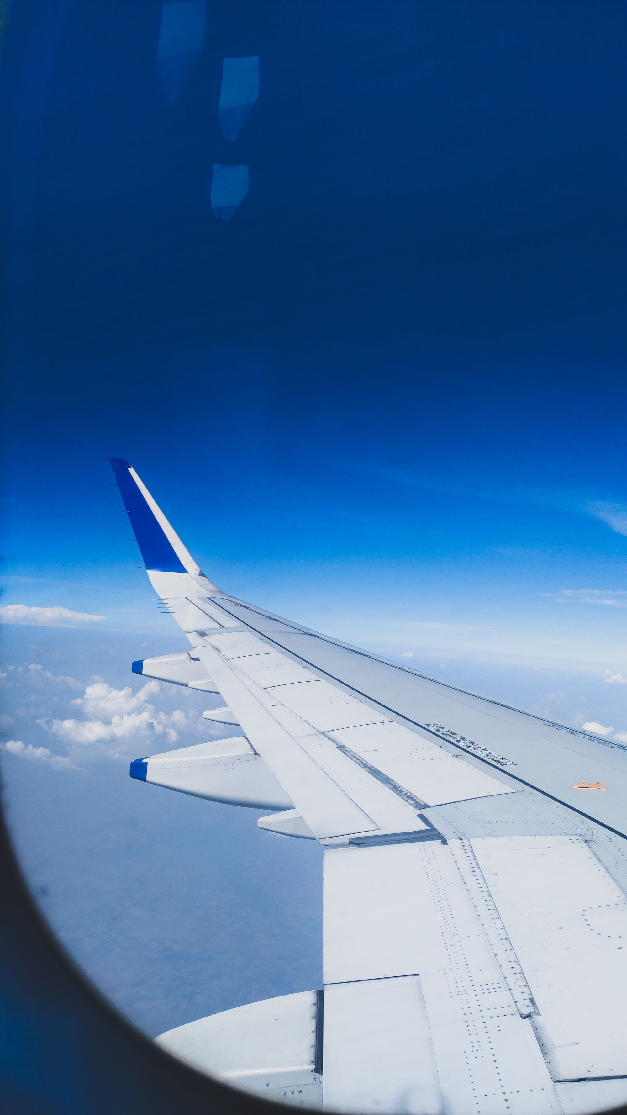 Airplane wing above the clouds